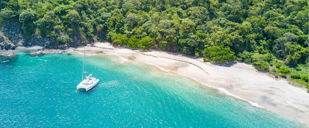 Catamaran sailing away from hotels and resorts in Papagayo Guanacaste